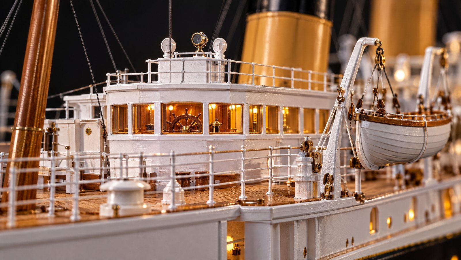 Concept render: macro close-up of the bridge windows with a tiny ship's wheel visible inside, plus railings and a lifeboat